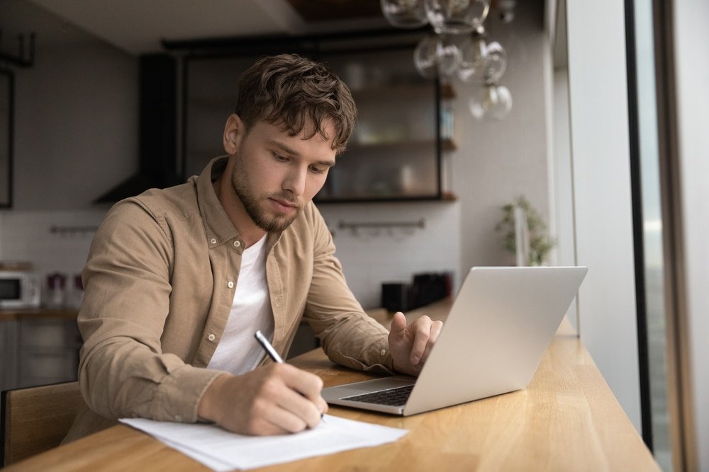 Young,Guy,Student,Prepare,Research,Essay,At,Modern,Kitchen,Surf