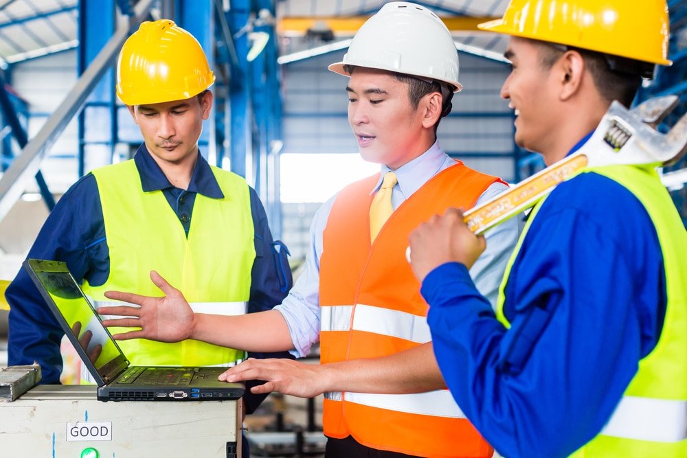 Team,Of,Workers,And,Engineer,In,Factory,At,Production,Training