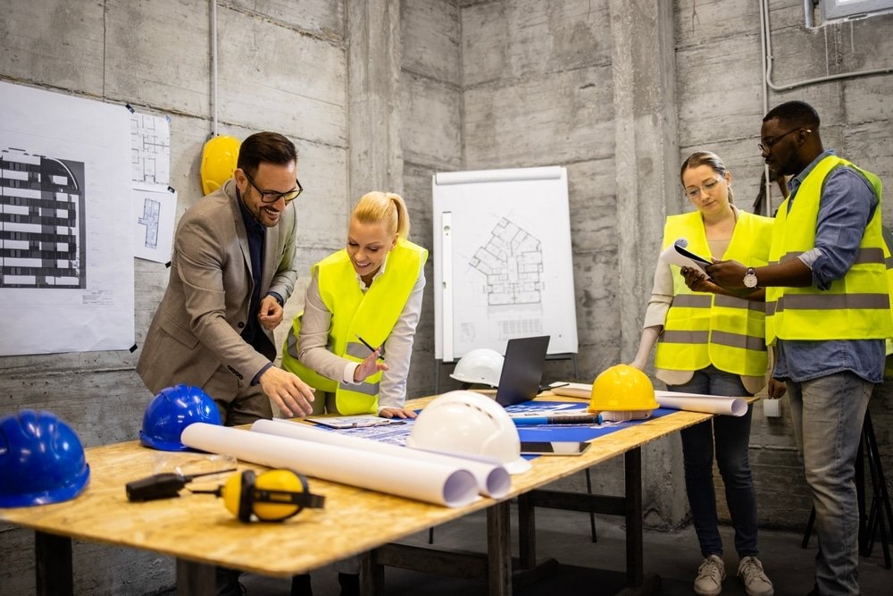 Team,Of,Experienced,Architects,And,Engineers,Analyzing,And,Looking,At